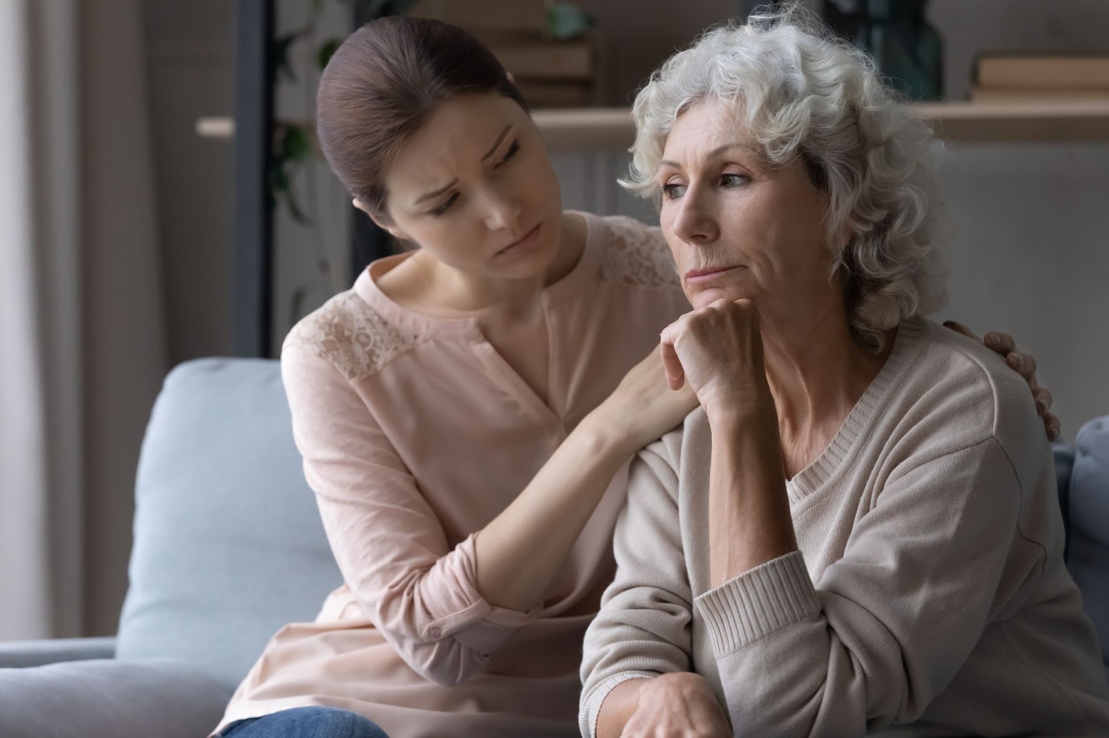 A family caregiver feeling overwhelmed while navigating interactions with a loved one experiencing memory challenges.